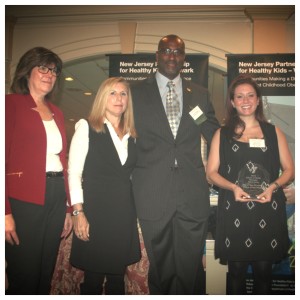 The City of New Brunswick was recently awarded the Culture of Health Champion Award from the New Jersey Partnership for Healthy Kids. (L-R) Fran Gallagher, Executive Director, NJ American Academy of Pediatrics; Peri L. Nearon, MPA, Director, External Affairs & Strategic Initiatives, NJ Department of Health; Darrin W. Anderson, PhD, State Deputy Director, New Jersey Partnership for Healthy Kids, and Briana Suffy, Management Specialist, City of New Brunswick Mayor’s Office, pictured at the Building a Culture of Health in New Jersey Conference on December 2 in Edison. 